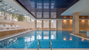 Indoor pool, seasonal outdoor pool, pool umbrellas, pool loungers