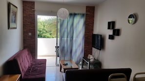 Apartment, 1 Bedroom, Balcony, Garden View | Living room | Flat-screen TV - Faneromeni Court (Paphos)