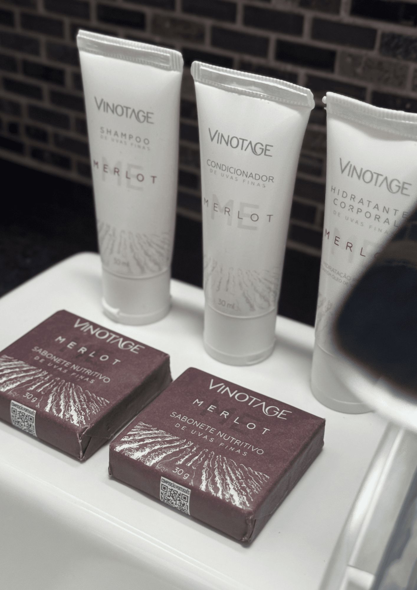 Three bottles of Vinotage Merlot shampoo and conditioner, and two boxes of Vinotage Merlot soap.