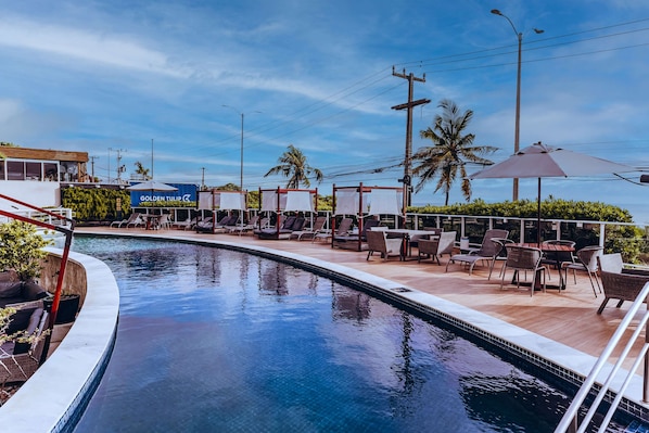 Outdoor pool, free cabanas, pool umbrellas