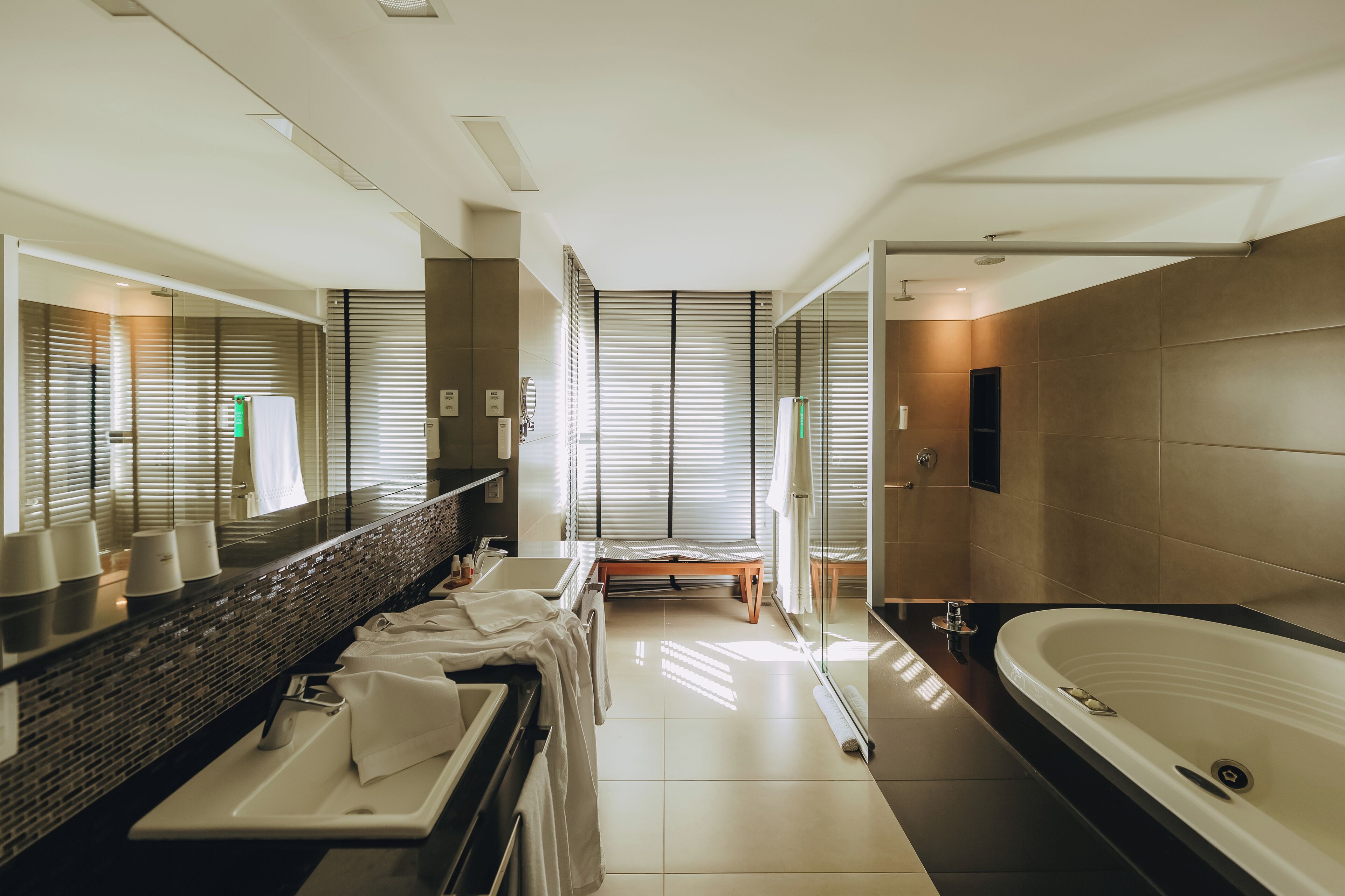 suite, 1 king bed, kitchenette, sea view | bathroom | shower, eco-friendly toiletries, hair dryer, towels