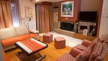 Villa, Private Pool | Living room | Flat-screen TV, fireplace