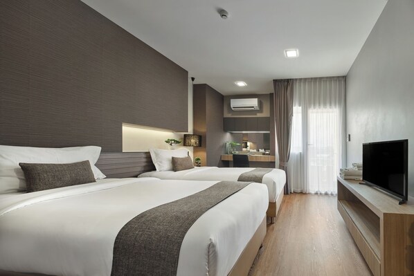 Deluxe Twin Room | Värdeförvaringsskåp på rummet, skrivbord och gratis wi-fi