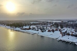 A lakeside village with wooden houses and docks. - Sportsman's Lodge (Baudette)