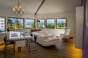 Premium Penthouse, 1 King Bed, Ocean View | Living area | Flat-screen TV