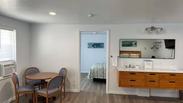 Deluxe Family Suite (room 12) | Living area | TV