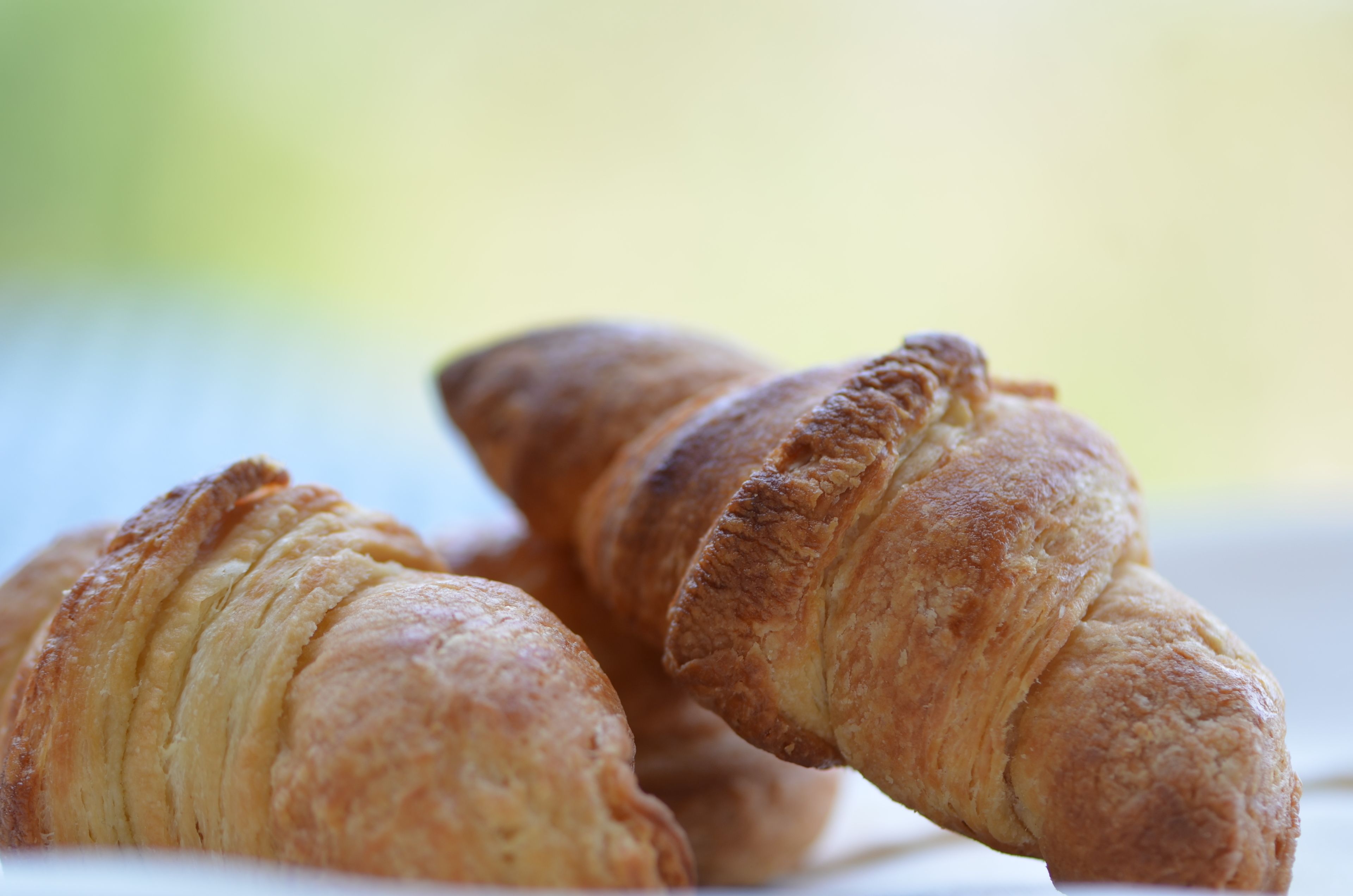 Three croissants on a plate.