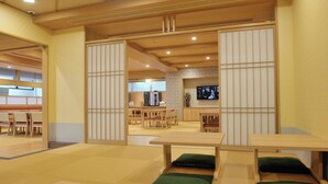 A traditional Japanese-style room with tatami flooring, low tables, and sliding doors. - Tennen Onsen Toyama Tsurugi no Yu Onyado Nono (Toyama)