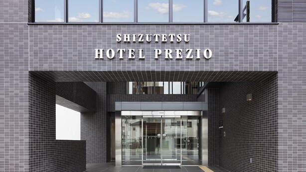The exterior of Shizuotsu Hotel Prezio with a modern tiled facade and a clear entrance. - Shizutetsu Hotel Prezio Numazu (Numazu)