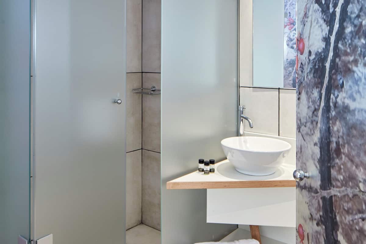 family room | bathroom | shower, rainfall showerhead, free toiletries, hair dryer