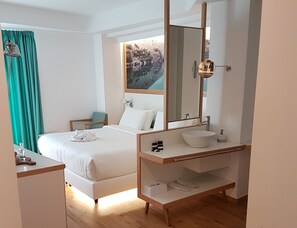 Luxe beddengoed, een minibar, een kluis op de kamer, een bureau