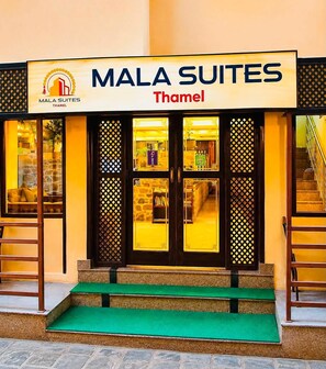 A hotel entrance with a sign reading 'MALA SUITES Thamel'. - Mala Suites Thamel (Kathmandu)