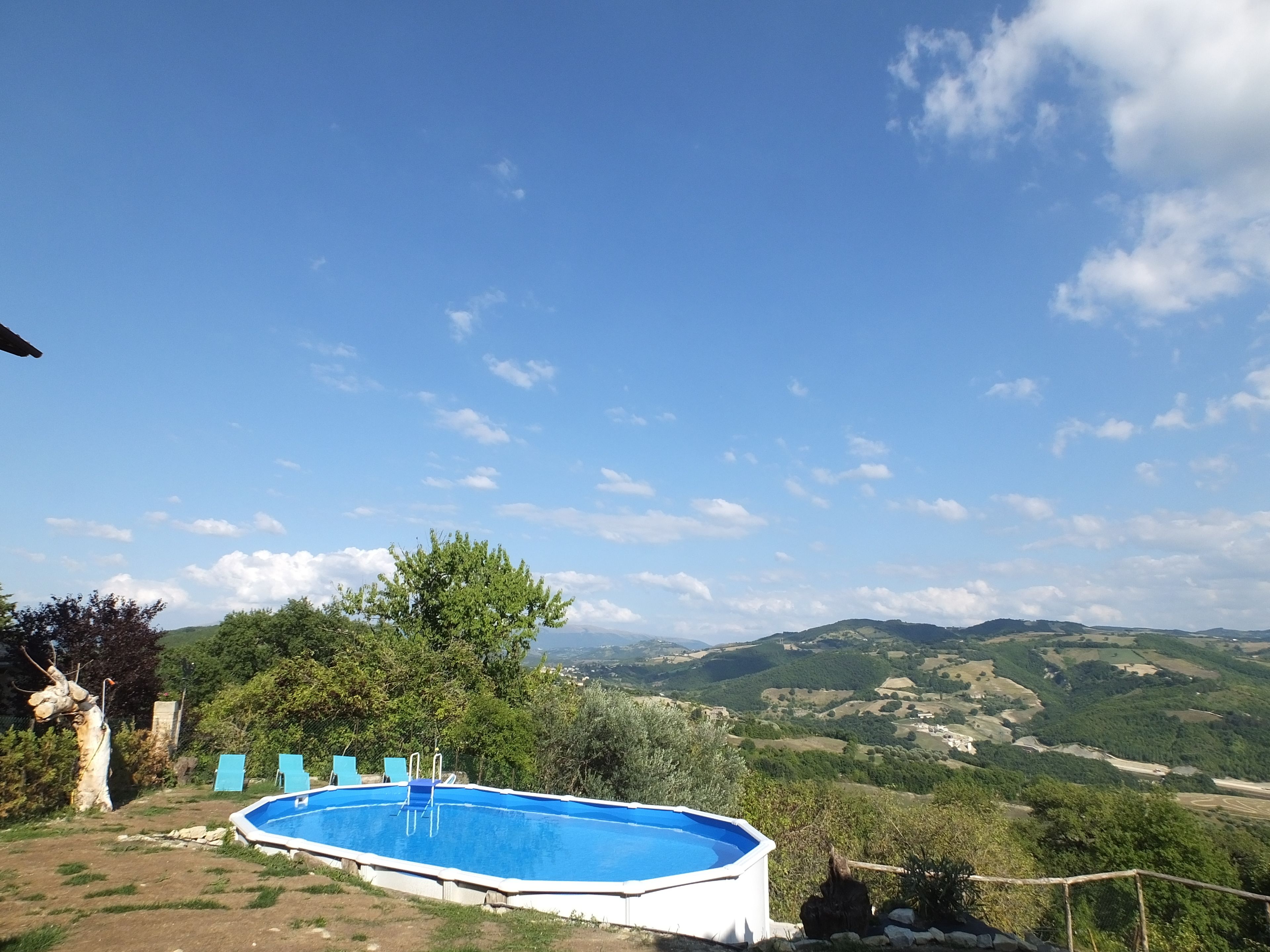Seasonal outdoor pool, open 9:00 AM to 7:00 PM, pool umbrellas