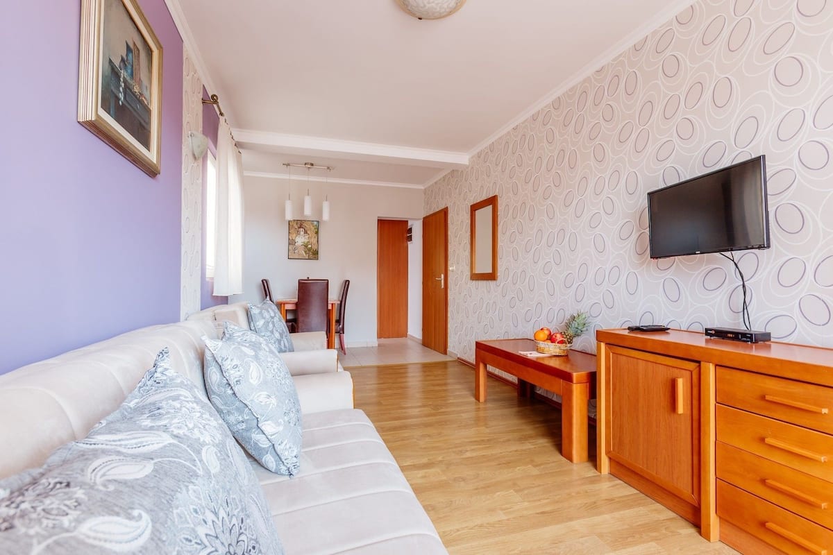 Appartamento Deluxe, 1 camera da letto, terrazzo, vista mare | Area soggiorno | TV a schermo piatto