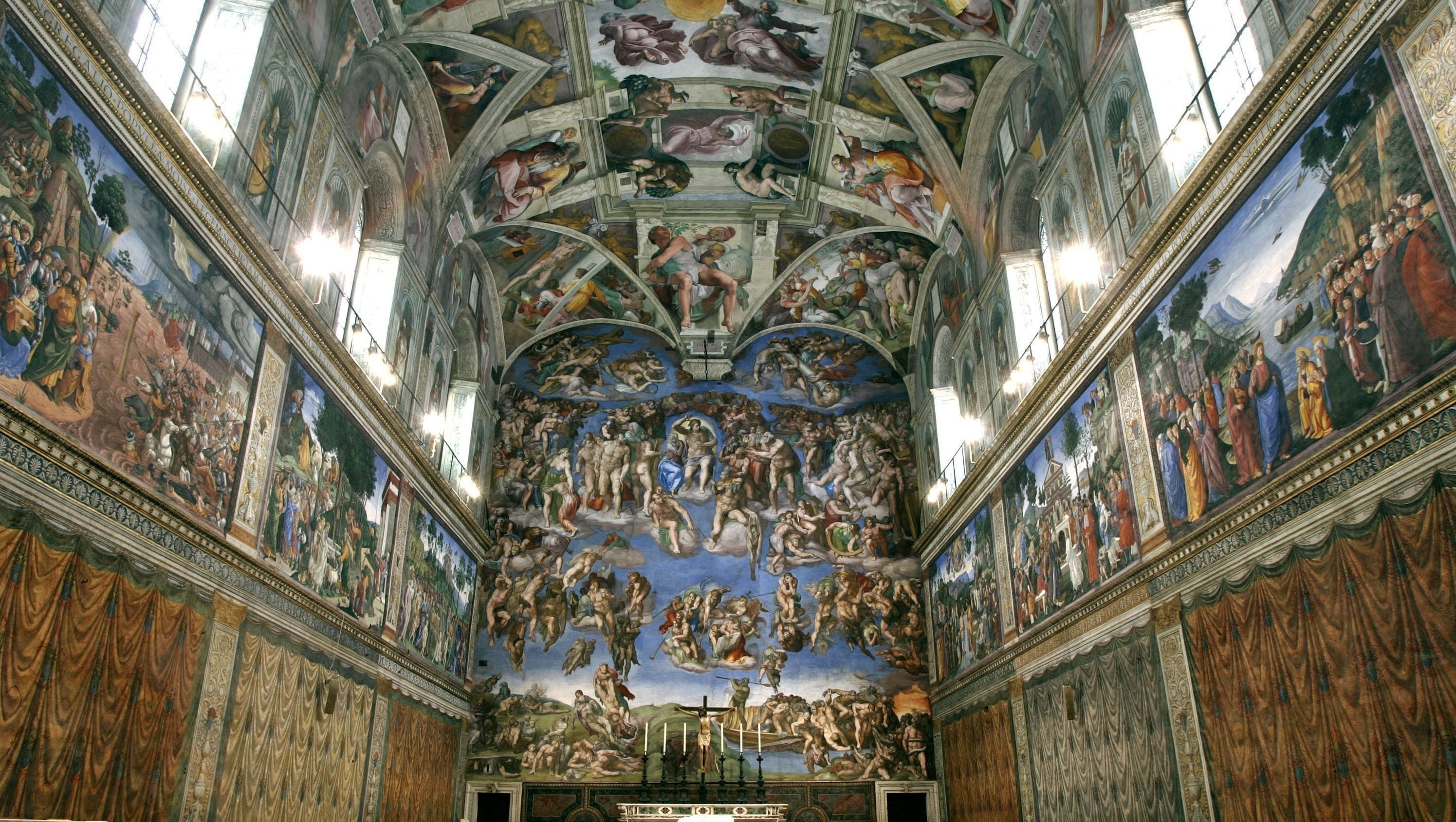 The interior of the Sistine Chapel with Michelangelo's ceiling frescoes.