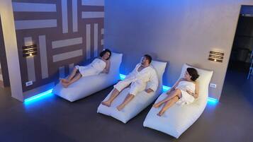 Relax in comfort with three beds, each featuring a massage chair.