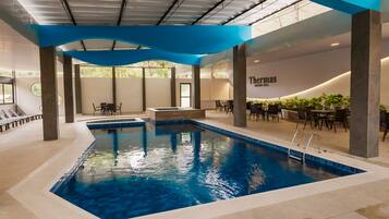 Indoor pool, outdoor pool, pool umbrellas, sun loungers