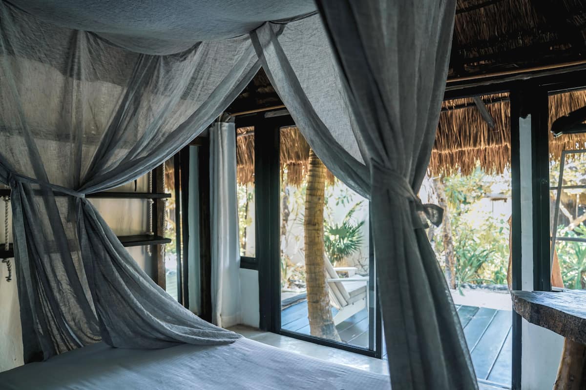 garden view shared bathroom | in-room safe, bed sheets