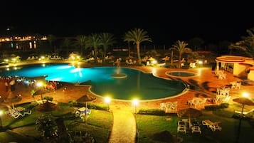 Indoor pool, outdoor pool, pool umbrellas, pool loungers