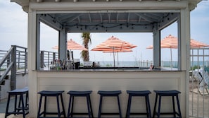 Outdoor pool, open 9:00 AM to 10:00 PM, pool umbrellas, sun loungers