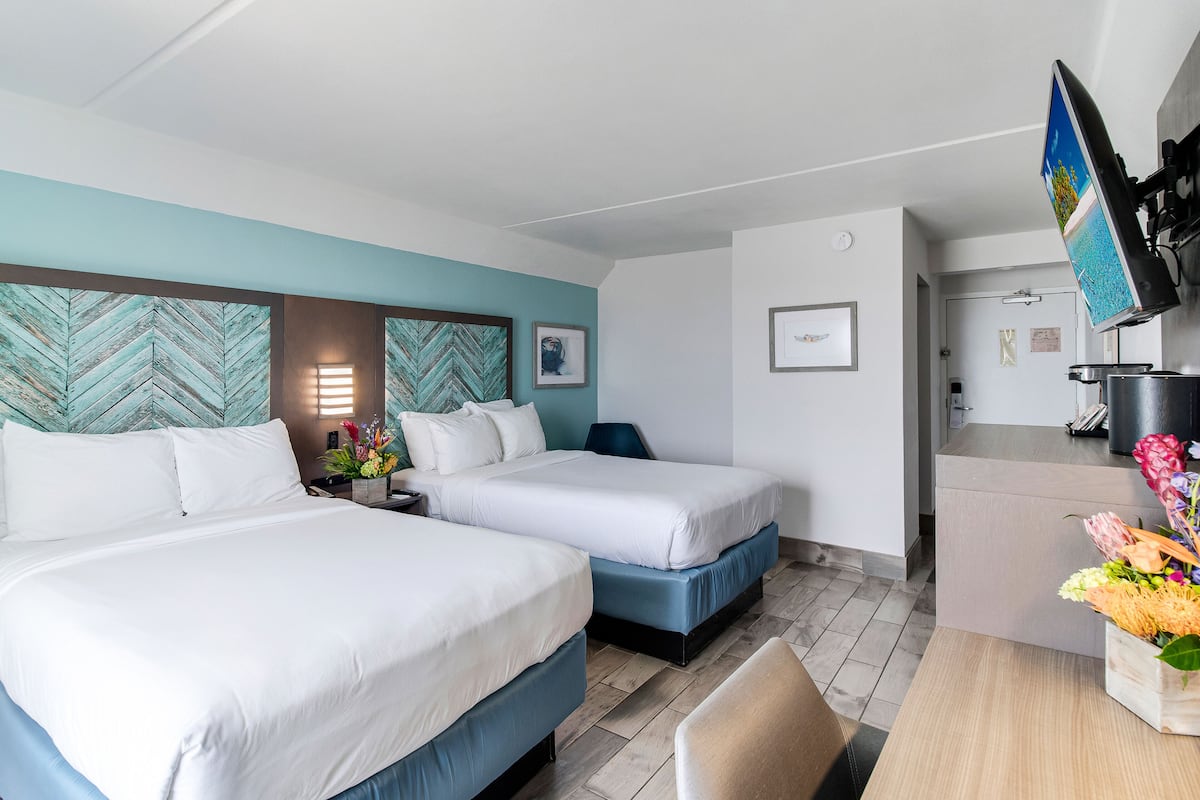 room, 2 double beds, ocean view | in-room safe, laptop workspace, iron/ironing board, free wifi