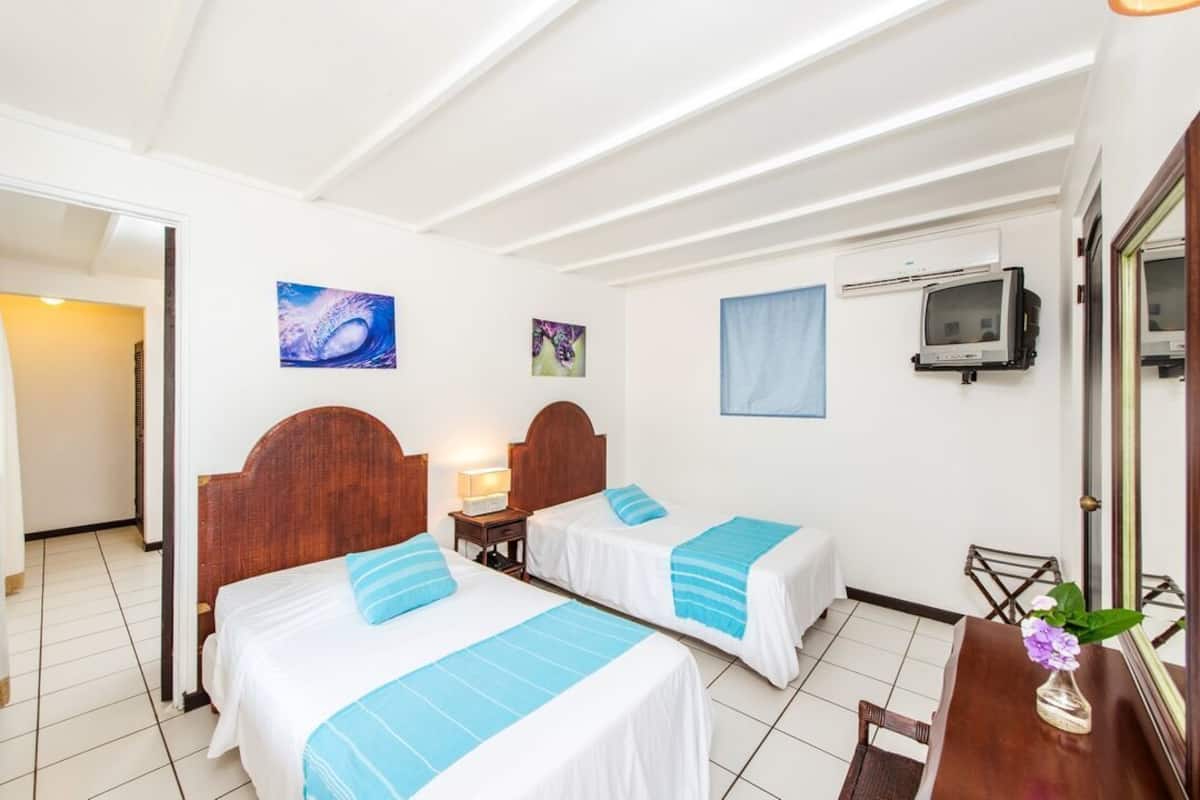 Chambre Standard, 2 lits une place | Coffres-forts dans les chambres, lits bébé (gratuits), Wi-Fi gratuit