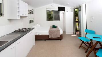 Studio Ensuite Cabin | Living area | 0-inch flat-screen TV with digital channels, LCD TV, DVD player
