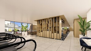 A modern interior with a seating area, a plant, and a view through large windows. - voco Seoul Myeongdong by IHG (Seoul)