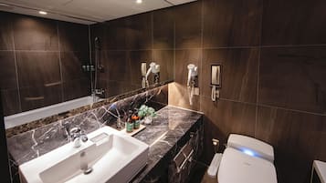 Designer toiletries, hair dryer, bathrobes, slippers