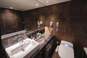 A modern bathroom with a large sink, a toilet, and a shower. - voco Seoul Myeongdong by IHG (Seoul)