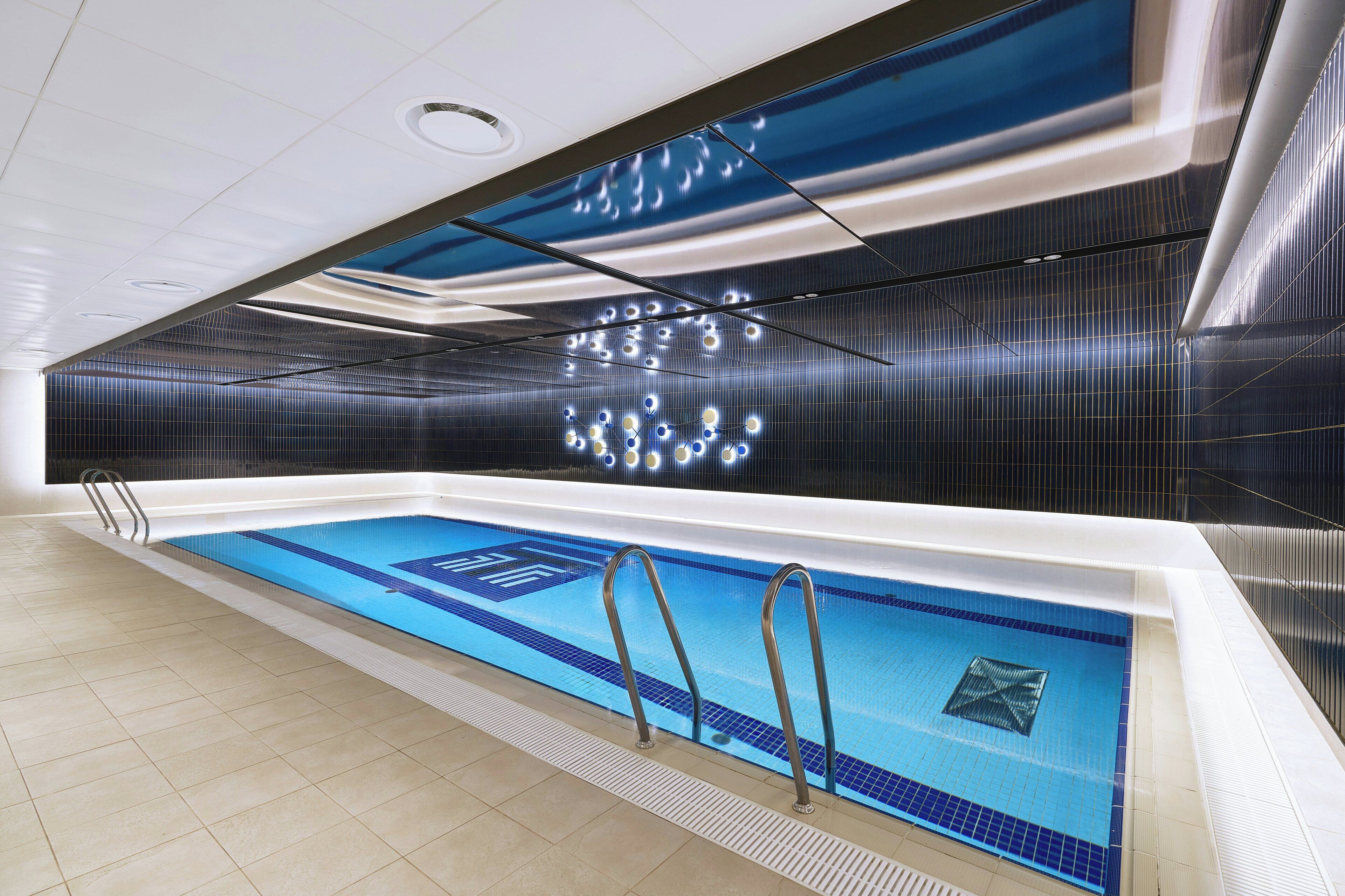 A swimming pool with clear lane markings and a tiled floor.