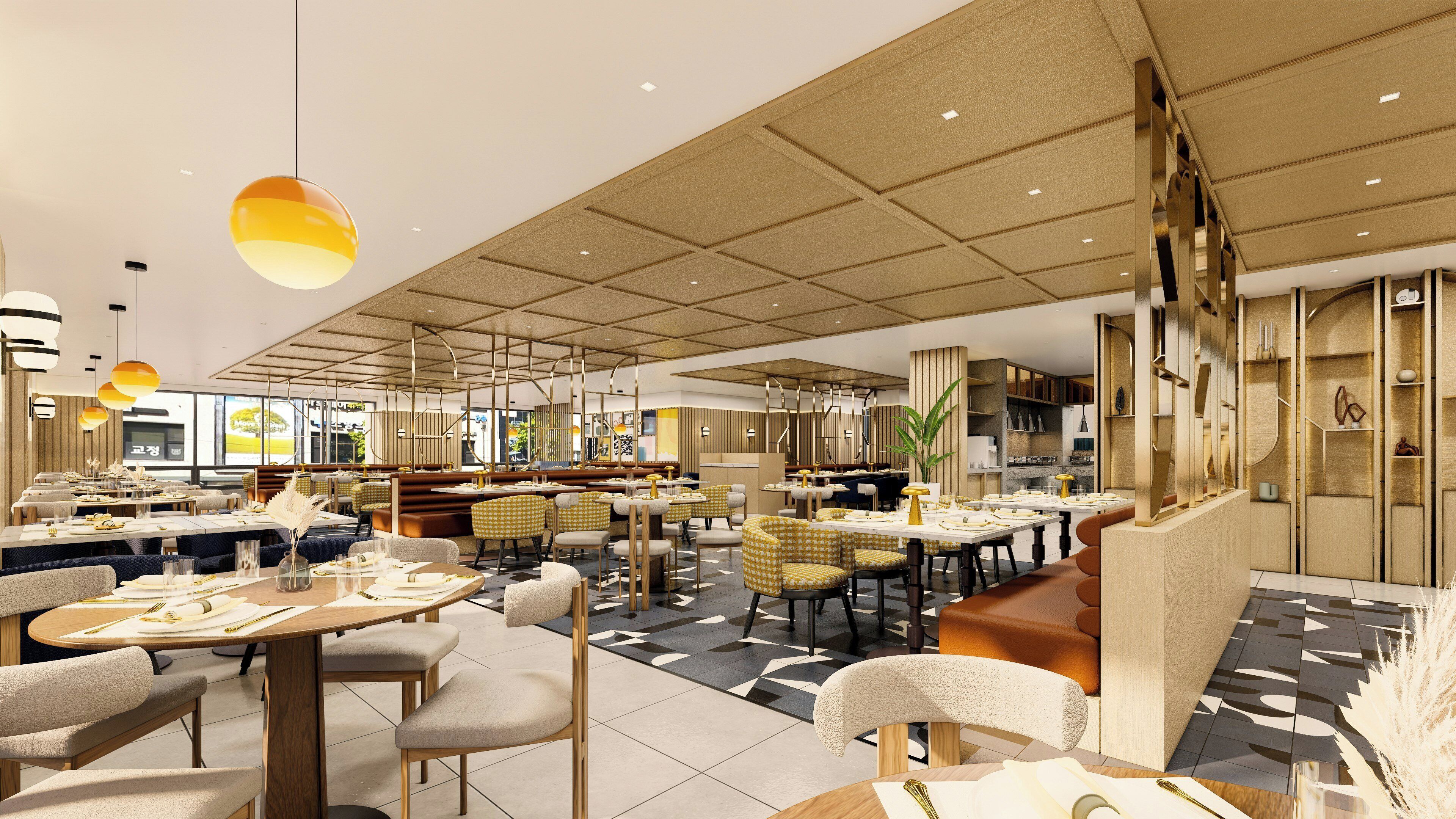 Un restaurante espacioso con varias zonas de comedor, incluyendo cabinas y mesas, y un diseño moderno de techo.