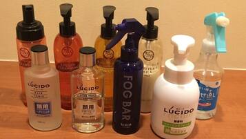A variety of personal care products including hair tonic, after shave lotion, and a fog bar.