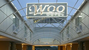The interior of the Woo Hotel with a prominent illuminated sign and a glass ceiling structure. - HOTEL WOO - Adults Only (Yamatotakada)