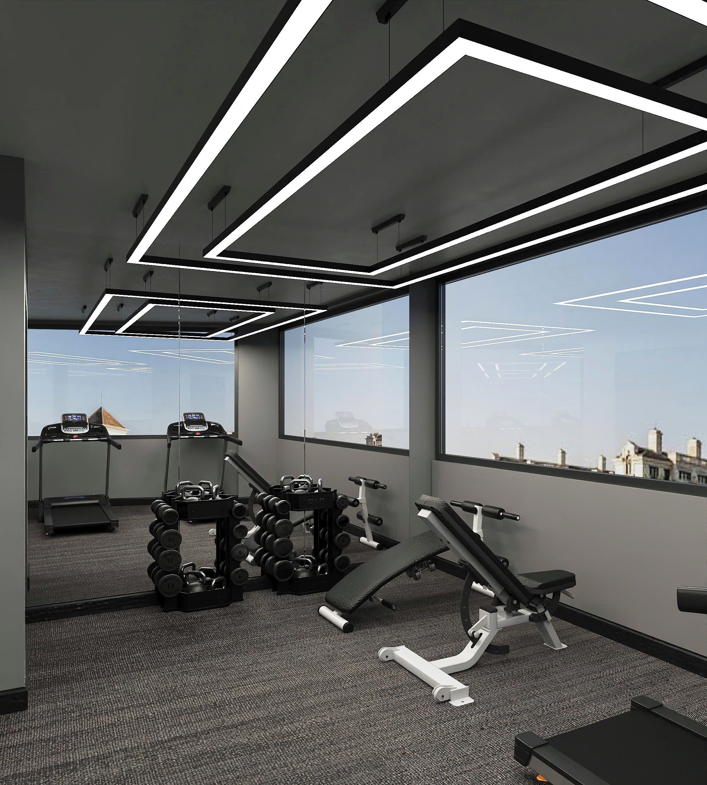 A modern gym with treadmills, dumbbells, and weight machines, large windows, and a view of the cityscape.
