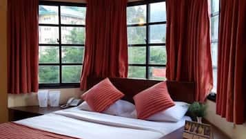 Desk, blackout drapes, iron/ironing board, rollaway beds