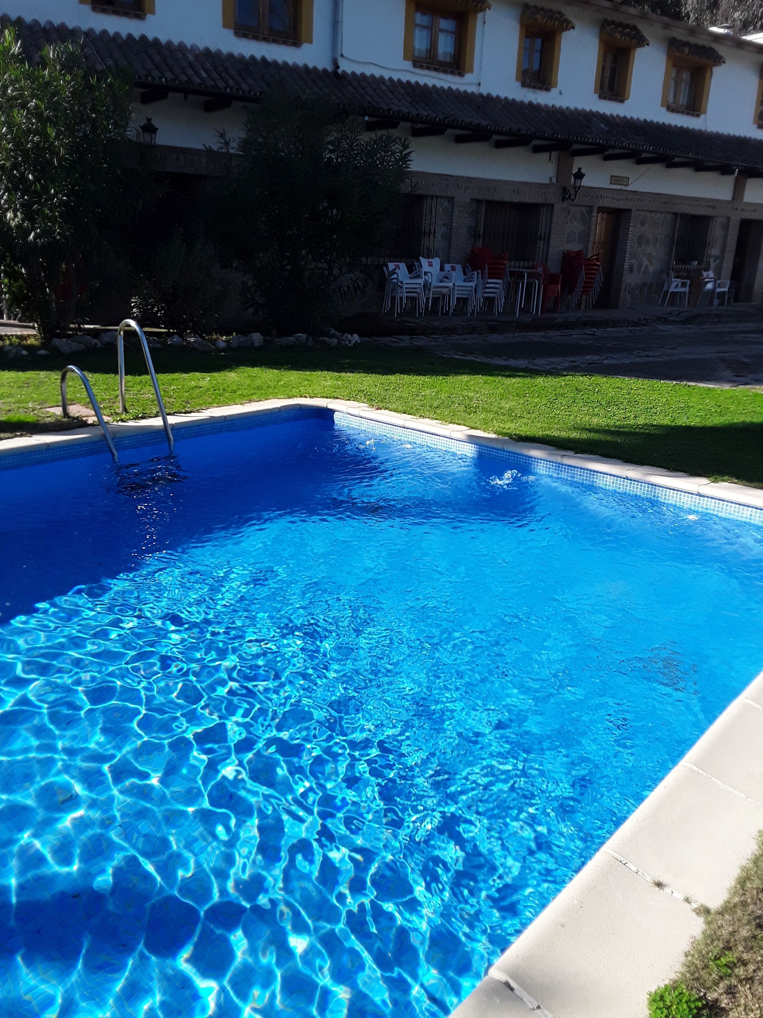 outdoor pool, pool umbrellas, pool loungers