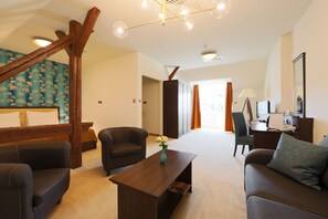 Suite, 1 Bedroom | Living room | Flat-screen TV