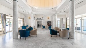 A spacious lobby with marble flooring, large columns, and modern seating arrangements. - Hotel Venice Beach - Families and Couples Only (Djerba Midun)