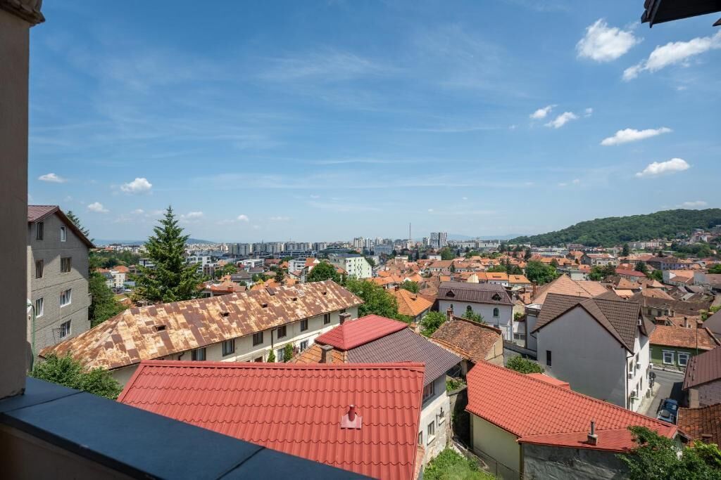 A residential area with red-tiled roofs and a mix of building styles, including some with balconies.