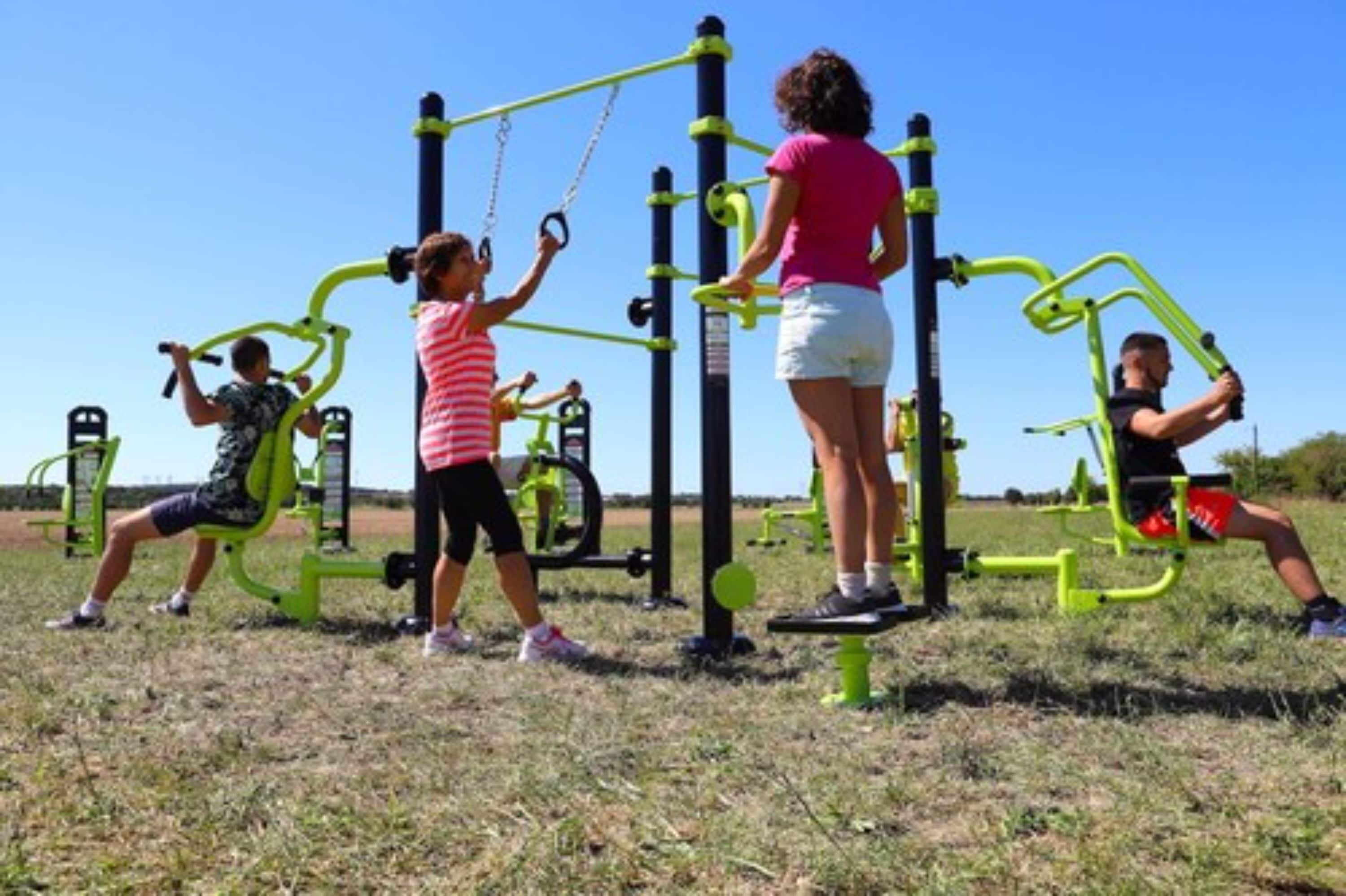 An outdoor exercise area with various fitness equipment.