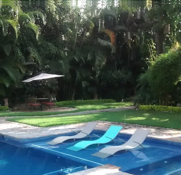 Outdoor pool, open 10:00 AM to 9:00 PM, pool umbrellas, sun loungers