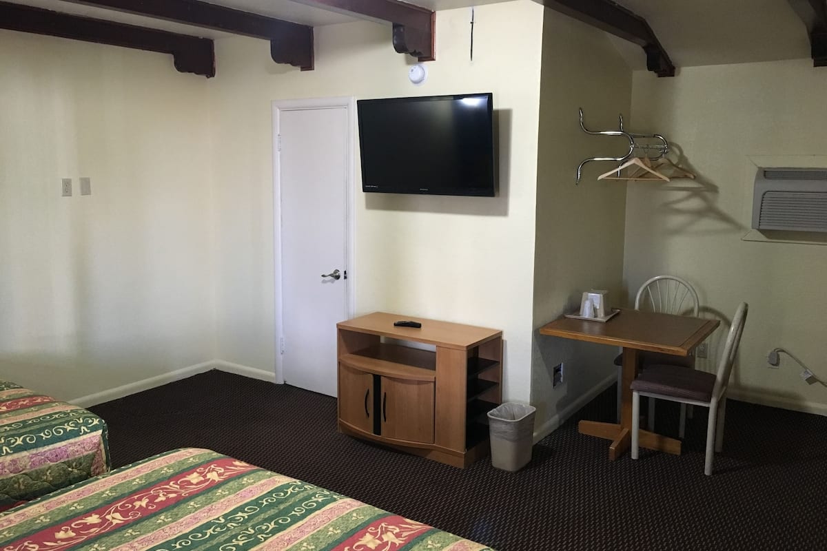Desk, blackout drapes, iron/ironing board, free cribs/infant beds