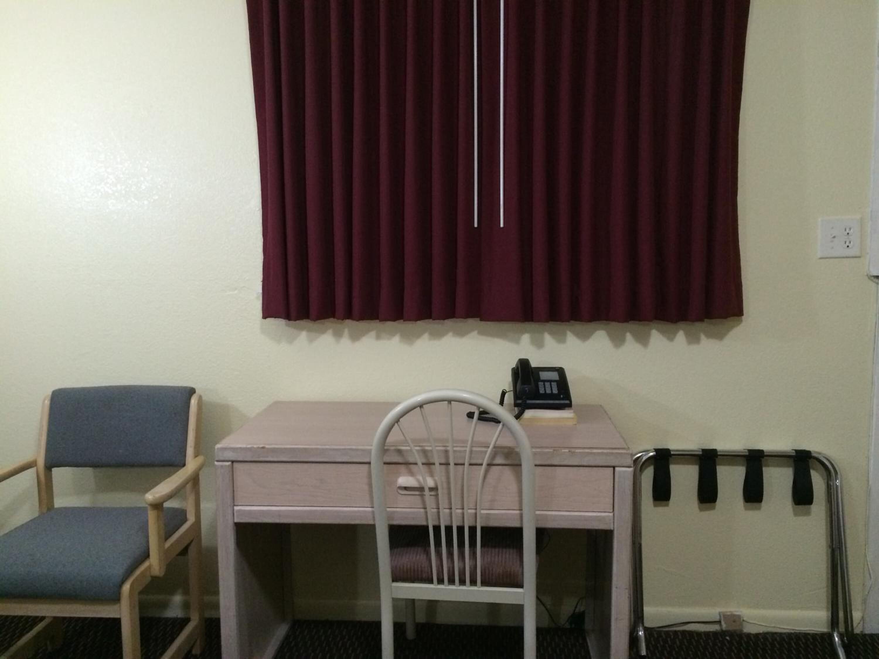 desk, blackout curtains, iron/ironing board, free cots/infant beds