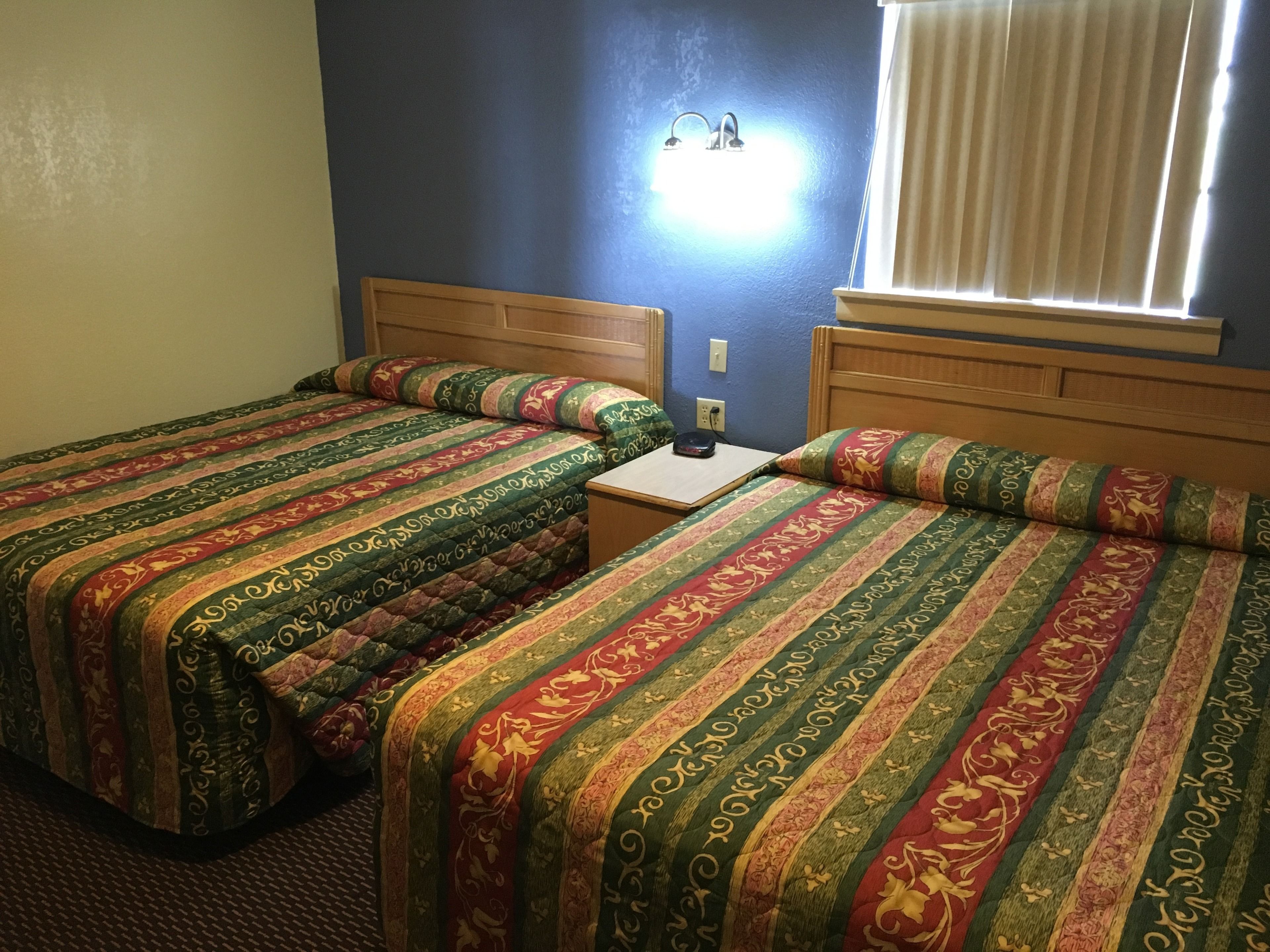 room, 2 queen beds | desk, blackout curtains, iron/ironing board, free cots/infant beds