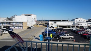 A parking lot with multiple cars, a pedestrian crossing, and a building labeled "Boardwalk Chapel".