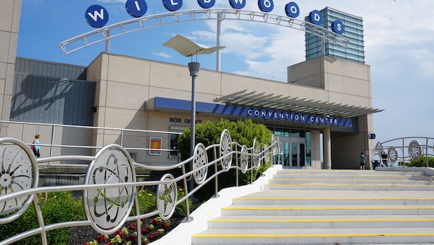 The Wildwood Convention Center entrance with a distinctive metal fence and steps leading up to the entrance.