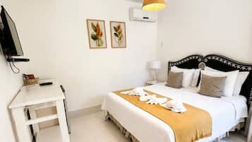 Deluxe Double Room | Minibar, in-room safe, individually decorated, blackout drapes