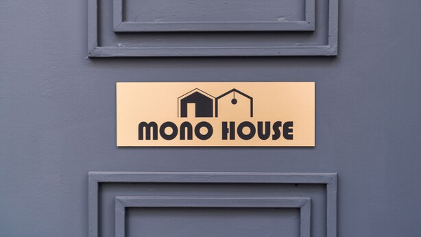 A sign with the text "MONO HOUSE" and a simple house icon. - Mono House Hongdae 2 (Seoul)