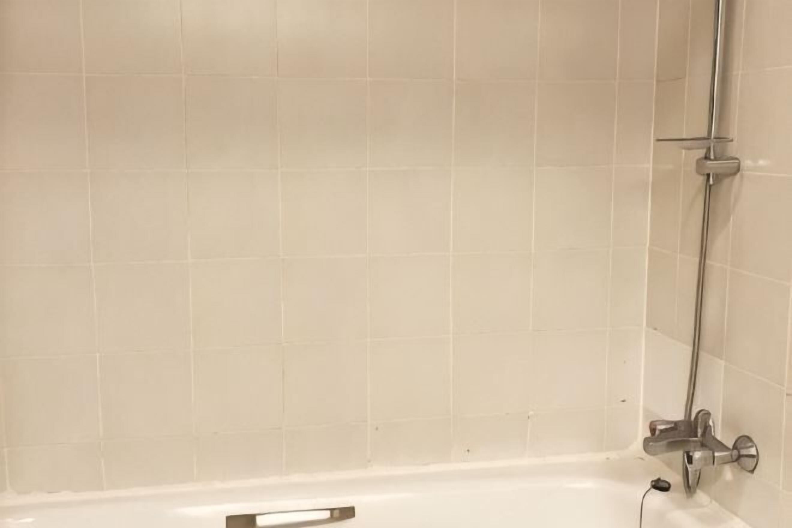 Bathroom | Combined shower/bathtub, free toiletries, hair dryer, slippers